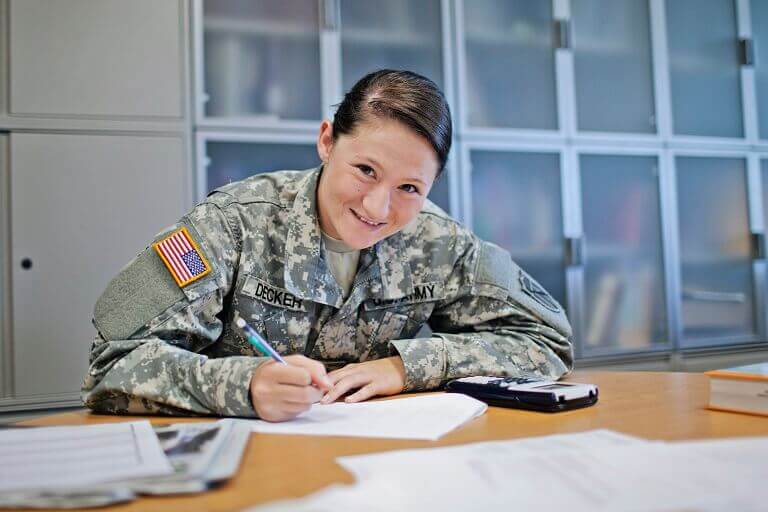 female in uniform at desk
