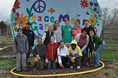 group of students in peace meal garden