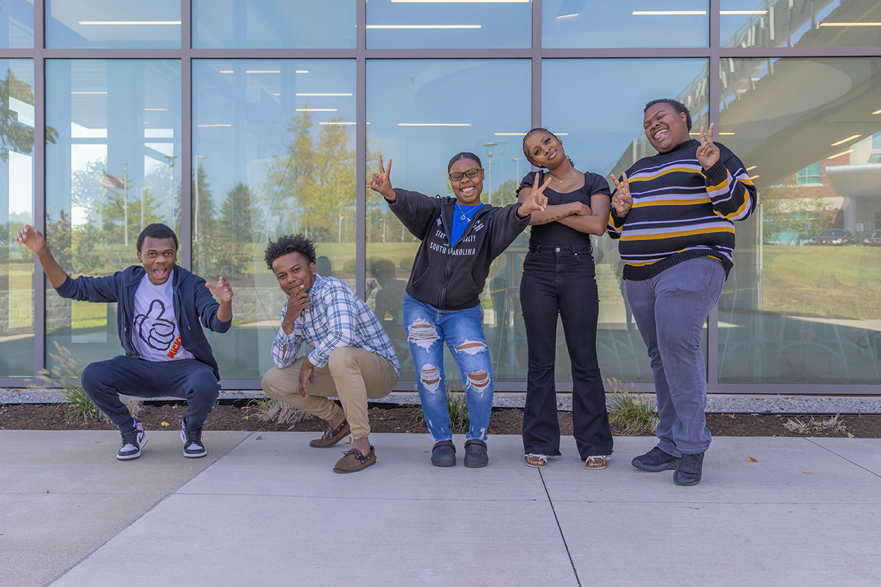 a group of bctc students stand together smiling