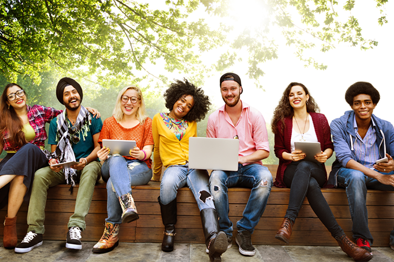 Students sitting together on bench