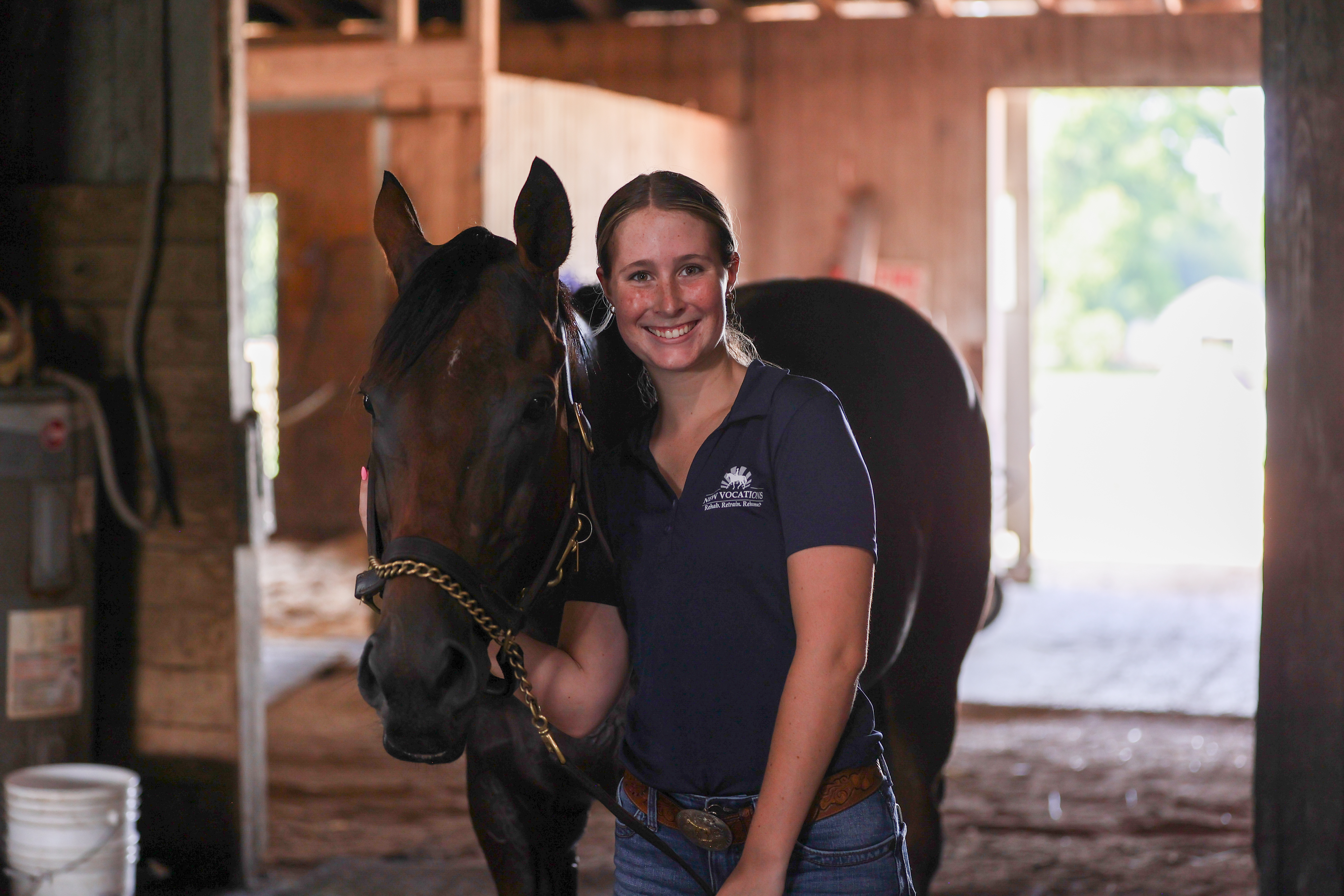 equine student smiling with a horse