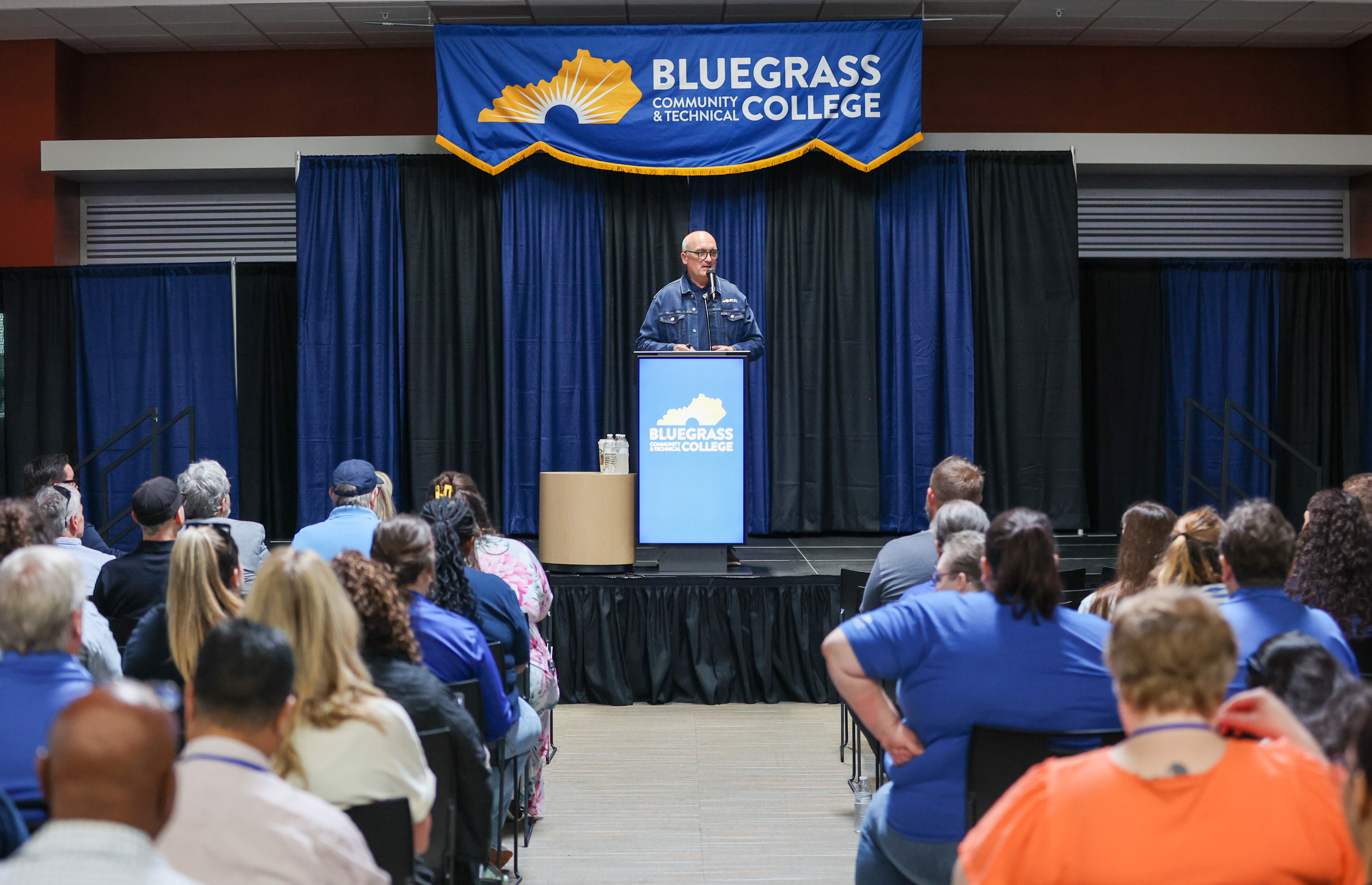 dr feeney giving a speech to employees