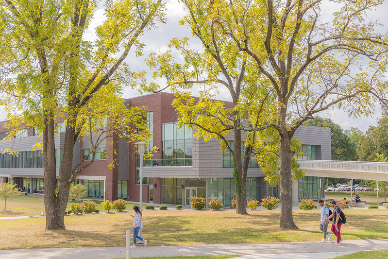 the science education center building with students walking to classes