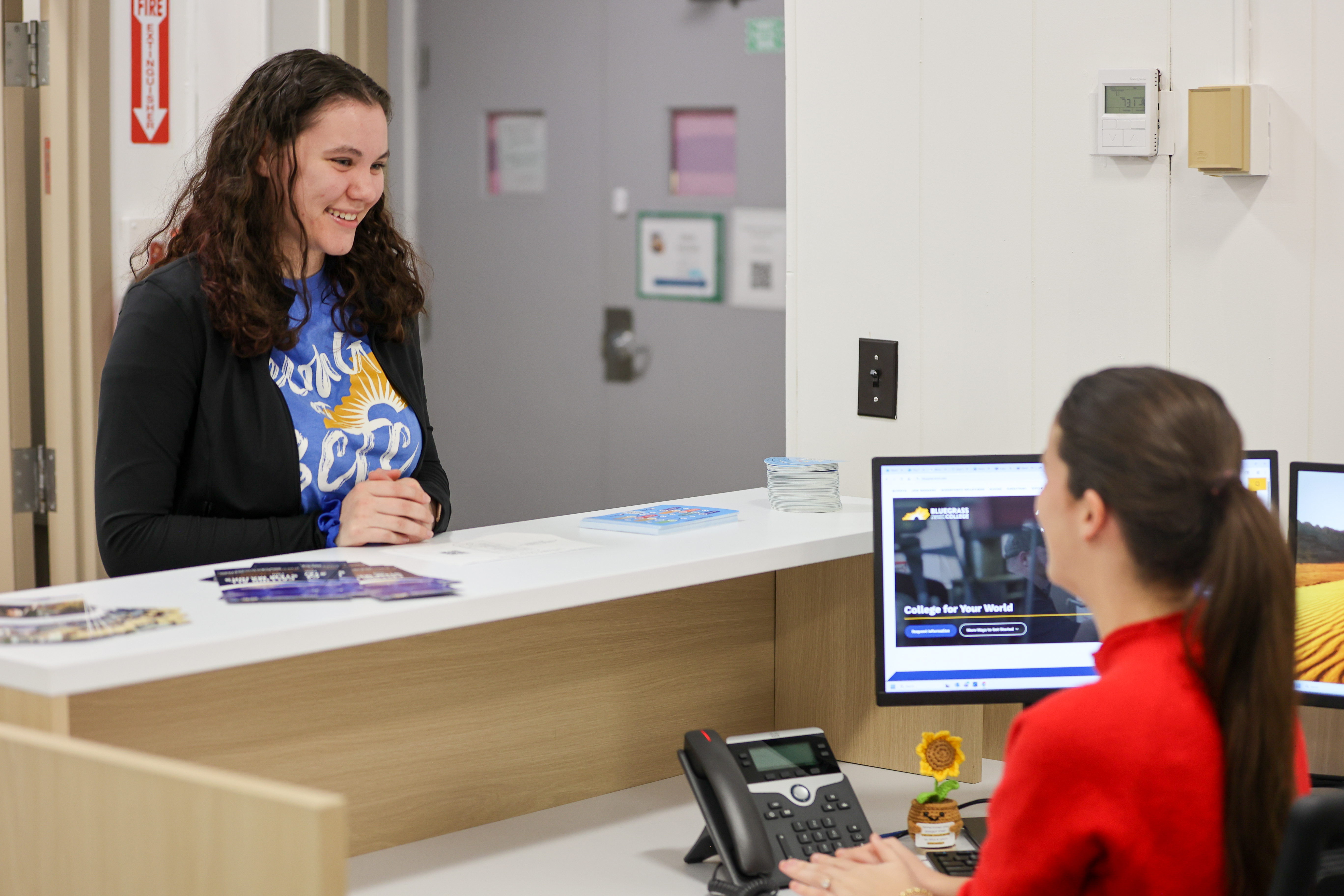 a student is greeted at the front desk