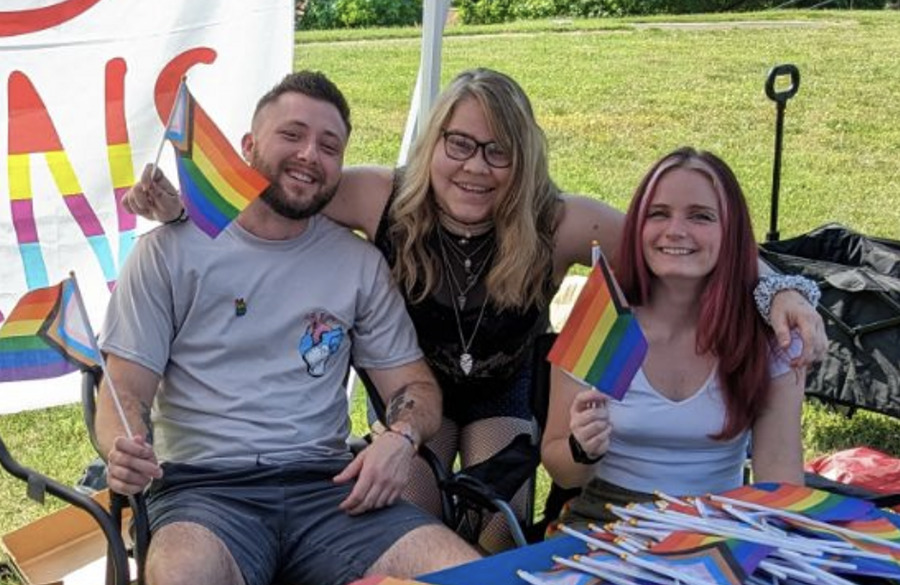 group photo of SAGA members at resource fair table