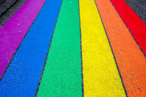 pride flag colors painted on a street
