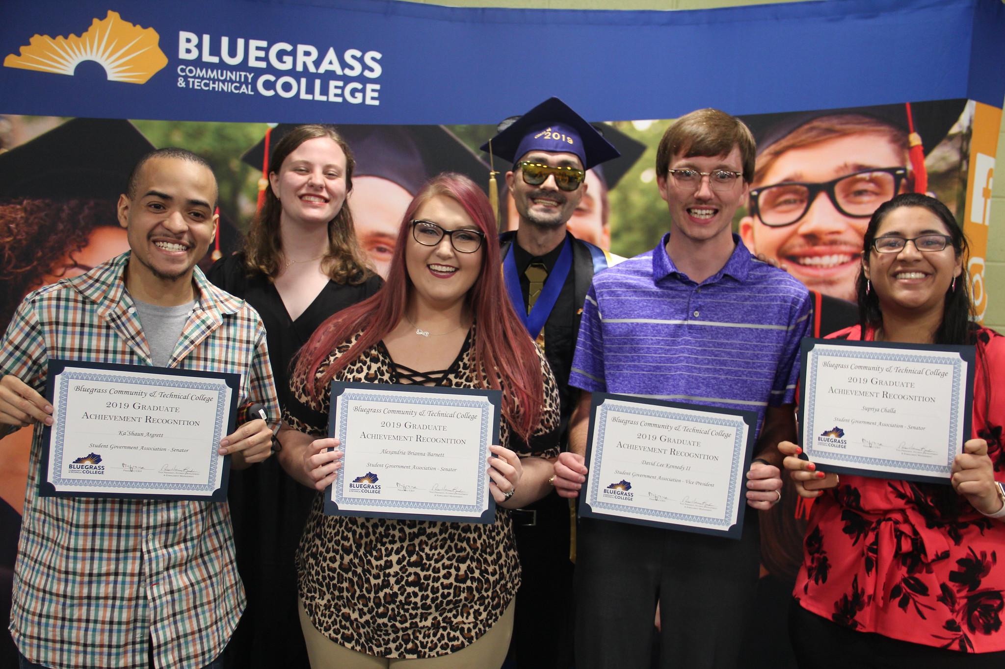 students with their Graduate Achievement Recognition awards
