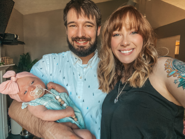 Image of Shelby Carter with partner and baby