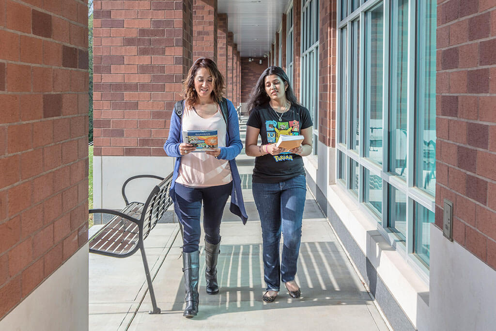 girls walking smiling looking at camera