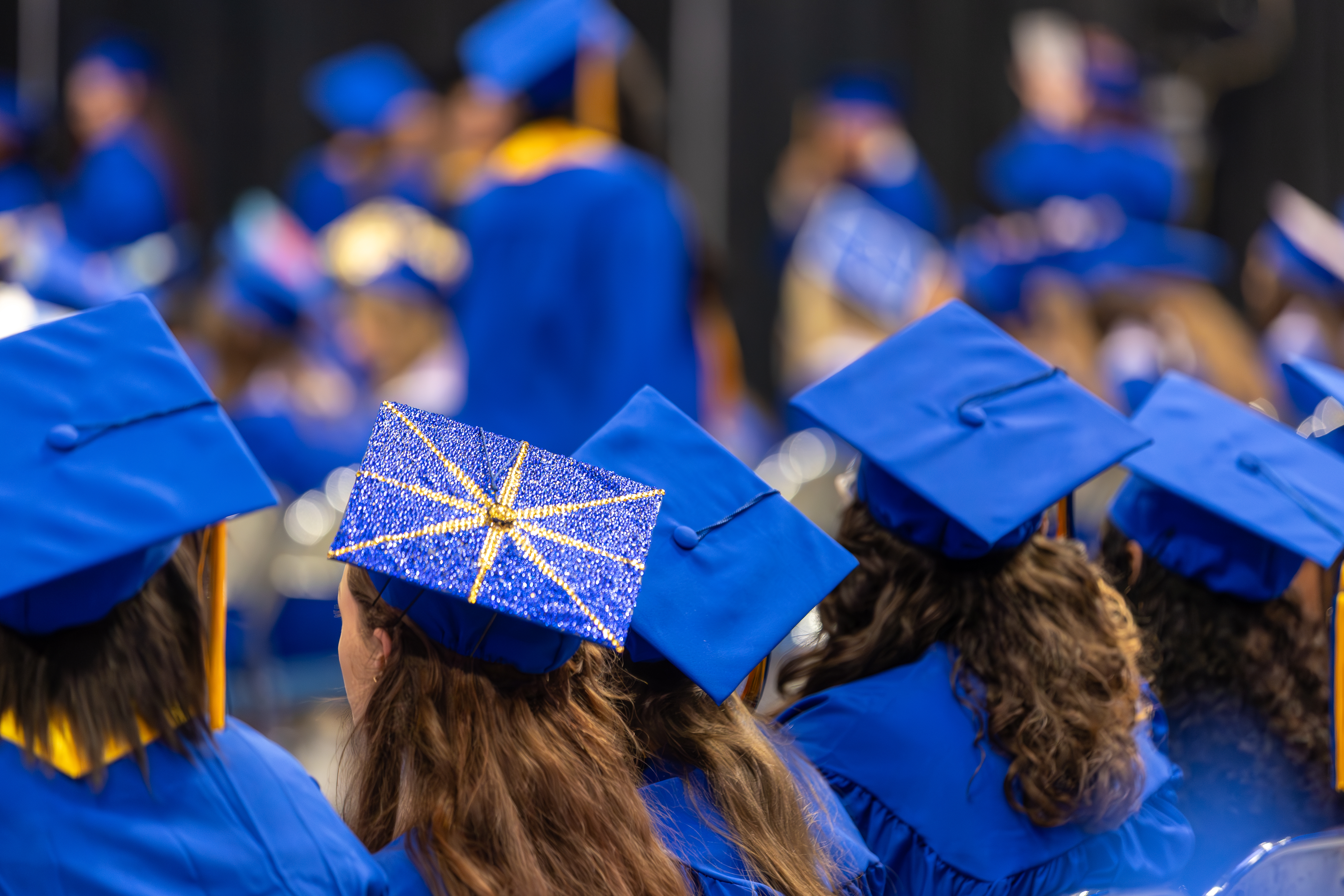 graduates turned towards the stage at commencement