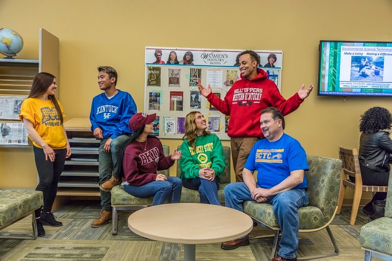 people in college sweatshirts