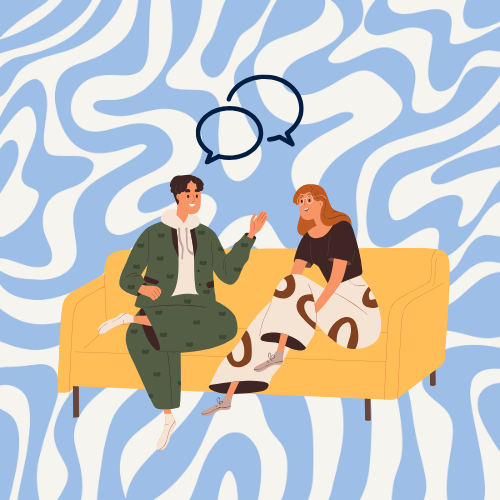 two people sit on a couch and talk together