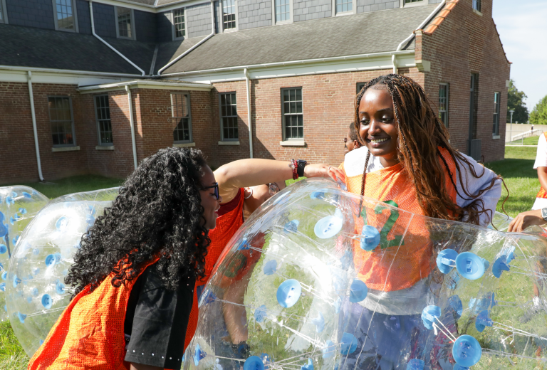 students playing on campus