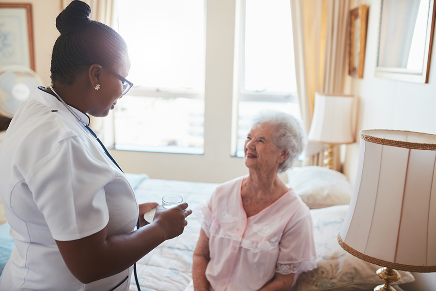 nurse talking to older woman
