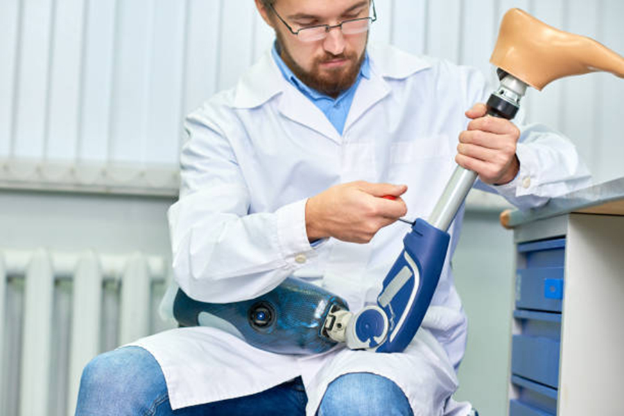 technician maintaining prosthetic leg