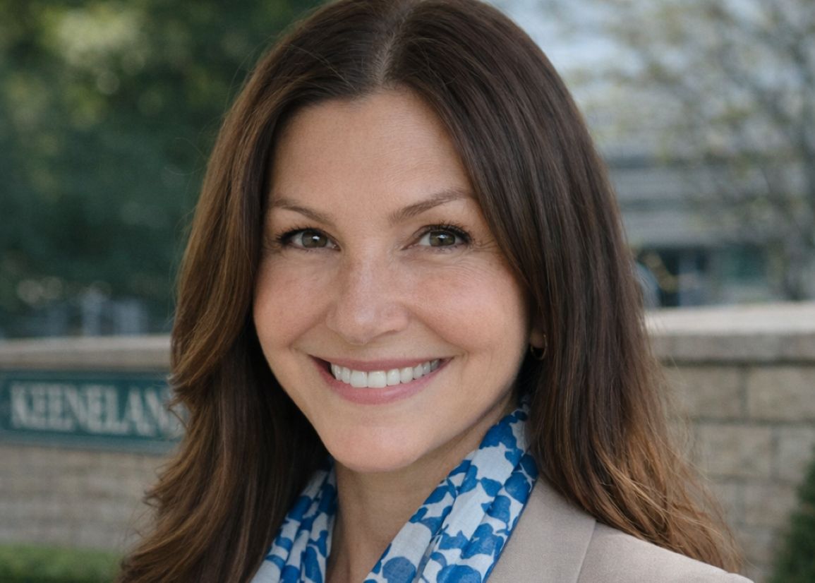 Marilee Herrara in front of Keeneland barrier wall