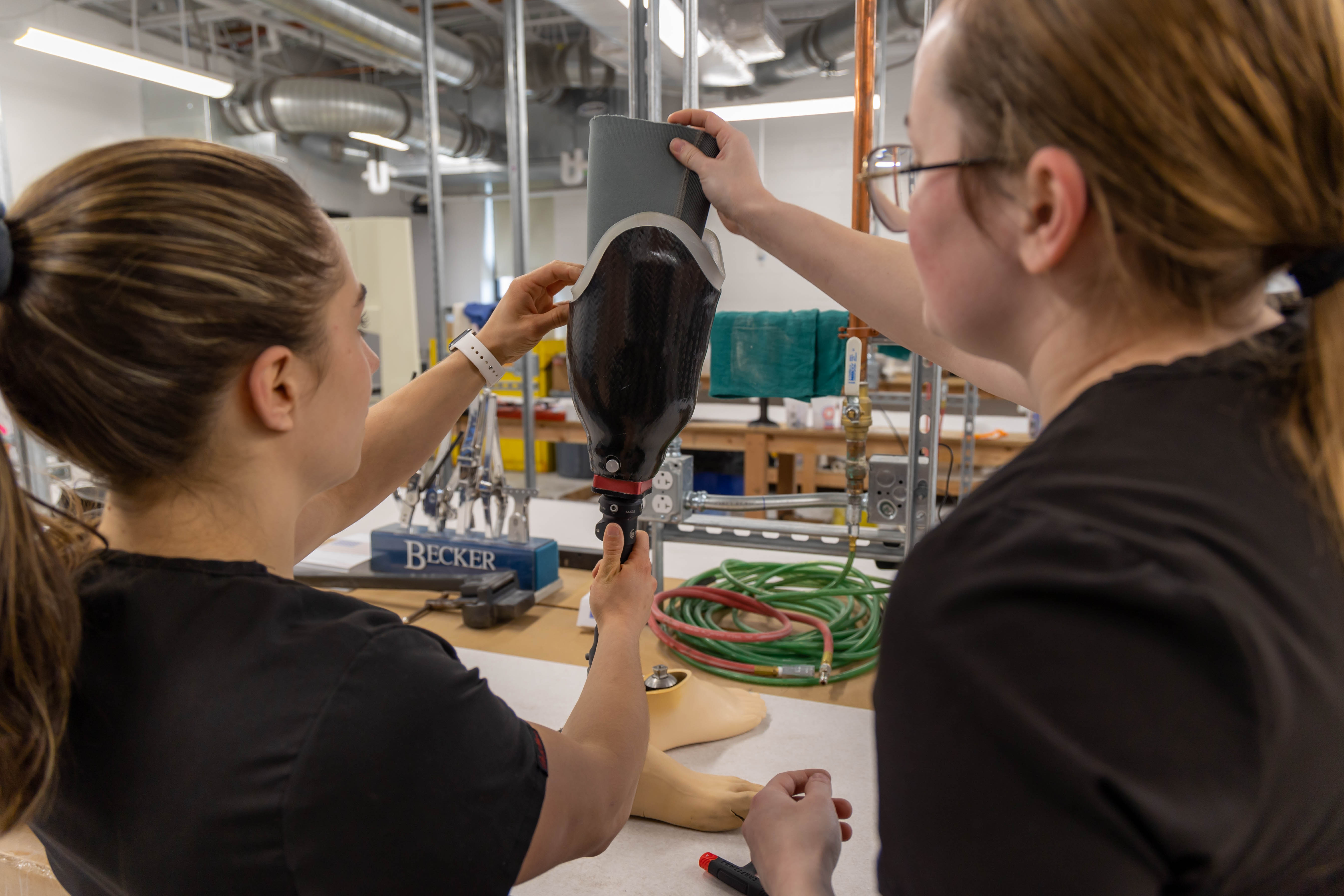 Students working on a prosthetic leg 