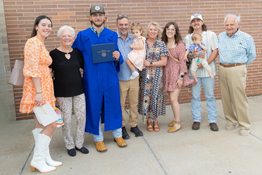 a group photo of a bctc graduate with their family