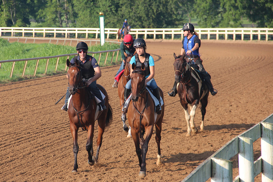 Equine Students on horseback on a track