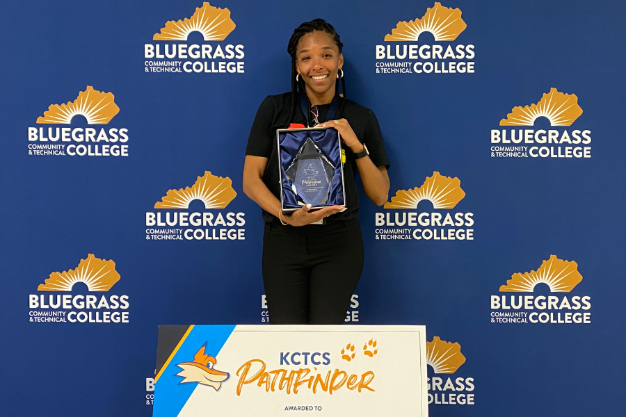 Brandy Ashford, 2023 KCTCS Pathfinder of the Year, holding her award