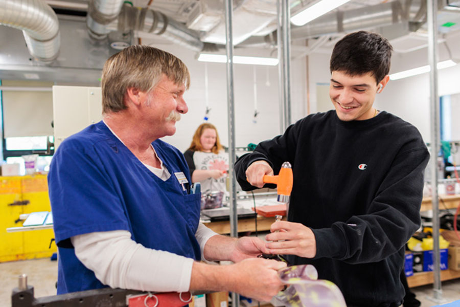 Mike Madden and an Orthotics and Prosthetics student