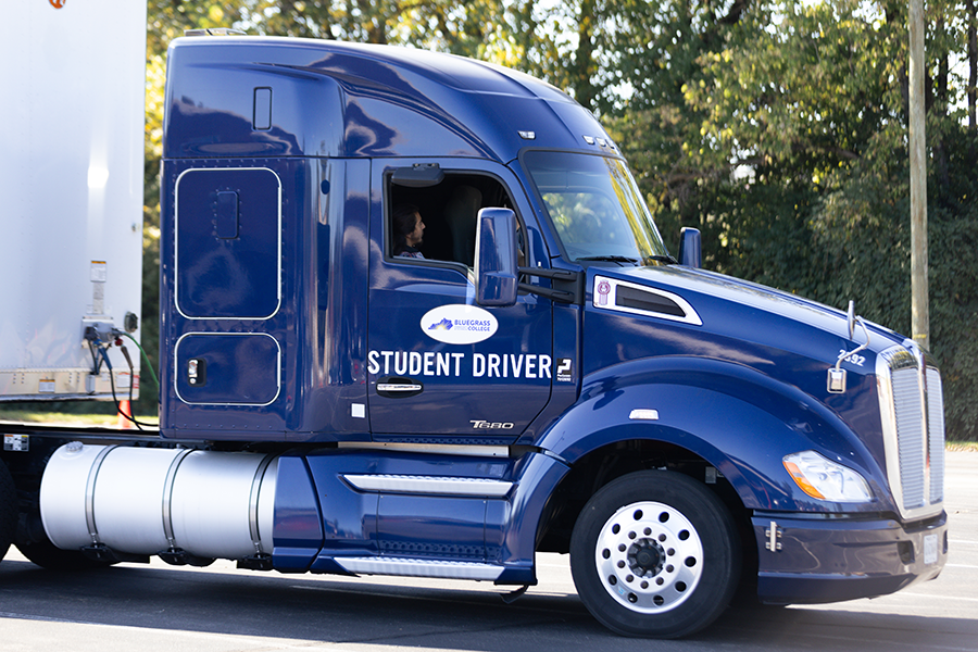 passenger talking to cdl driver in truck