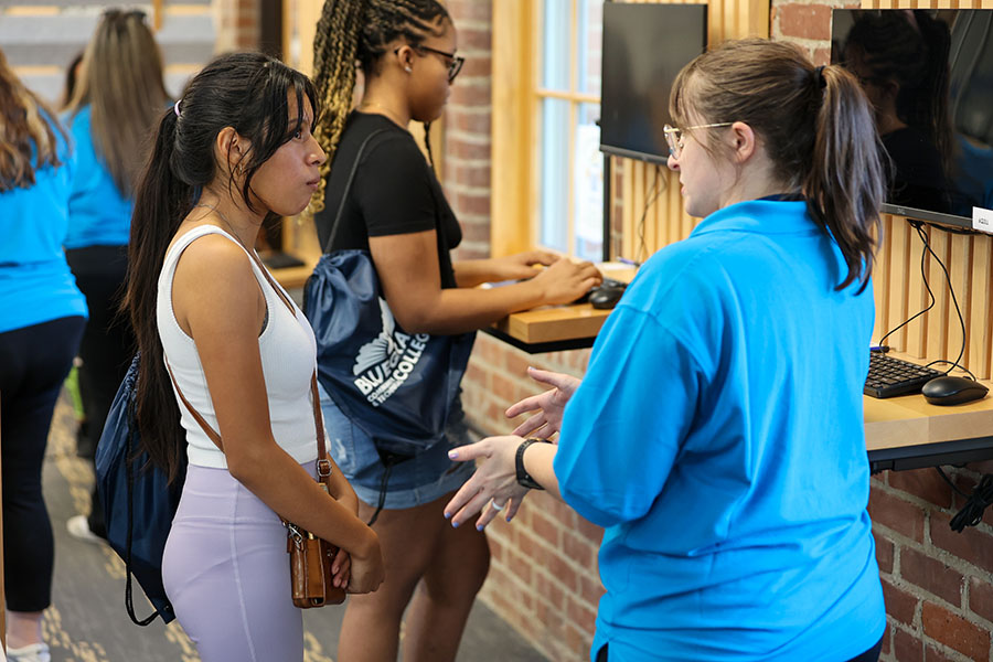 student talking with admissions staff