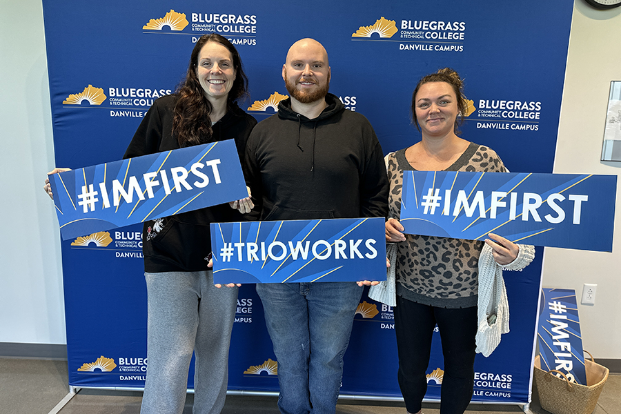 people holding signs for #ImFirst and #TRIOWorks in front of BCTC Danville backdrop