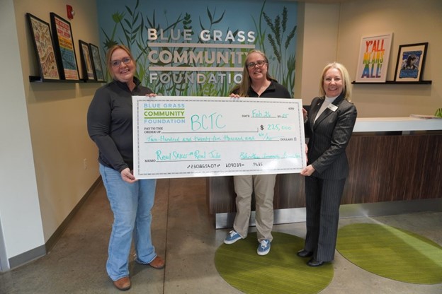 BCTC Staff holding oversized check