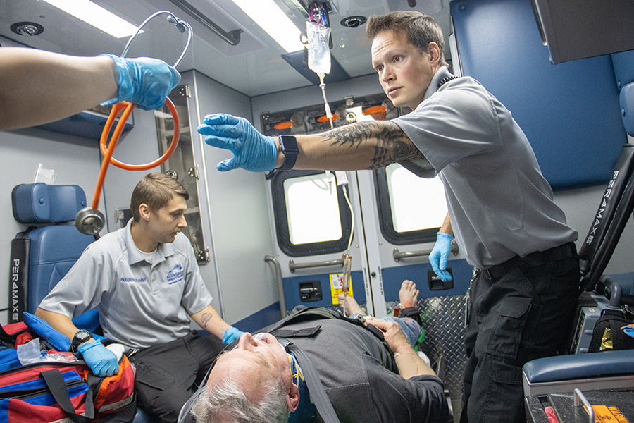 students in 2025 trauma scenario being handed stethoscope
