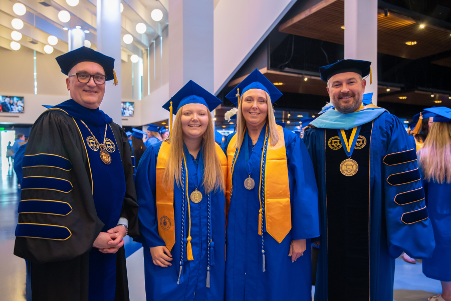 dr greg feeney with grads and dr quarles